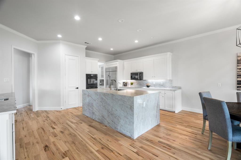 5120 Briar Tree Drive Dallas, TX 75248 - Photo 5 of 40 a living room with stainless steel appliances kitchen island granite countertop wooden floor and view living room
