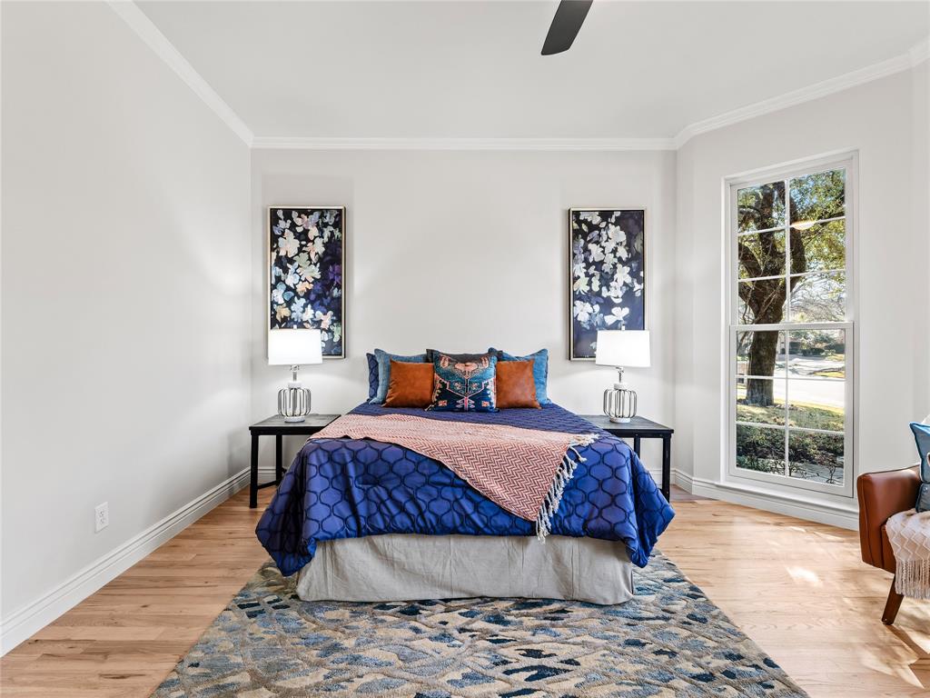 5120 Briar Tree Drive Dallas, TX 75248 - Photo 5 of 40 a bedroom with a large bed and a window