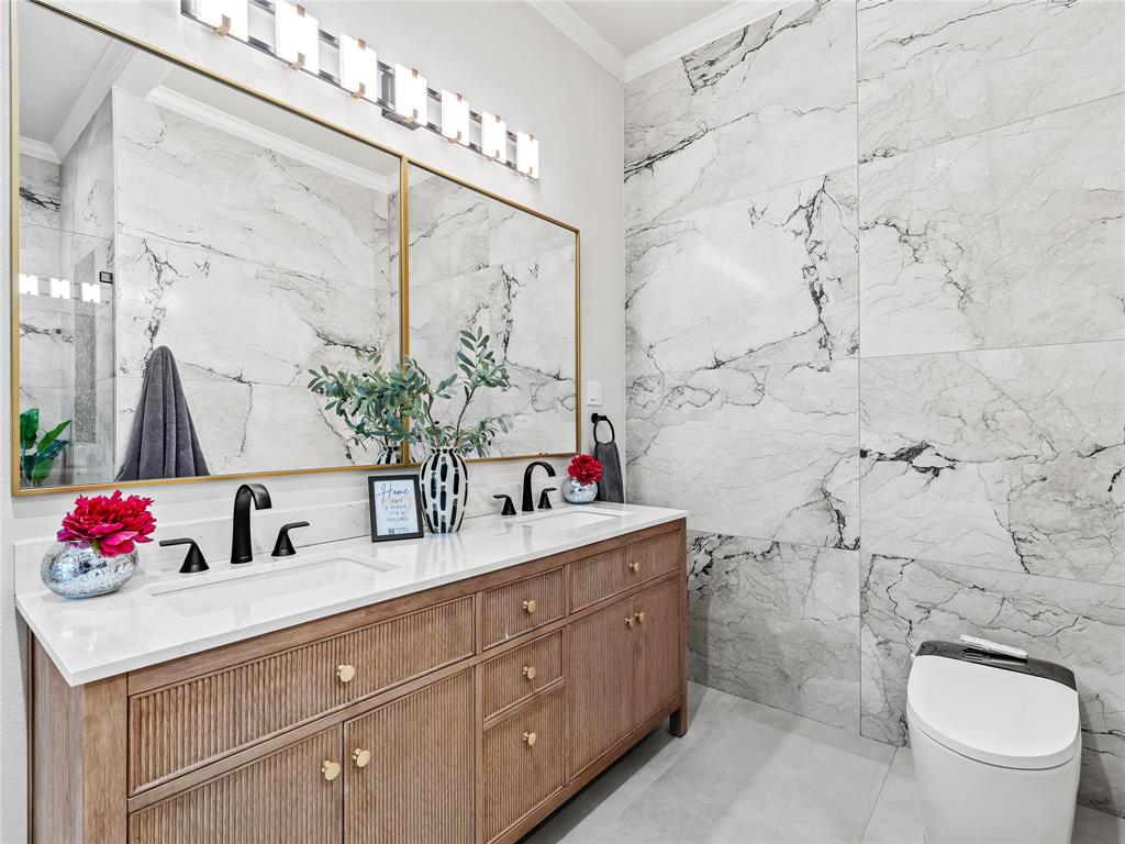 5120 Briar Tree Drive Dallas, TX 75248 - Photo 7 of 40 a bathroom with a sink vanity mirror and toilet