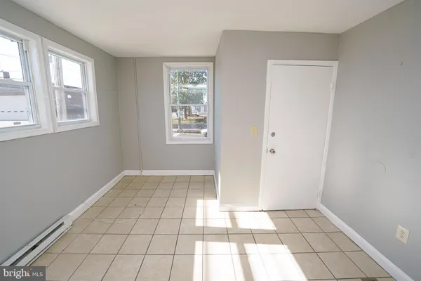 a white refrigerator freezer and a stove sitting inside of a kitchen