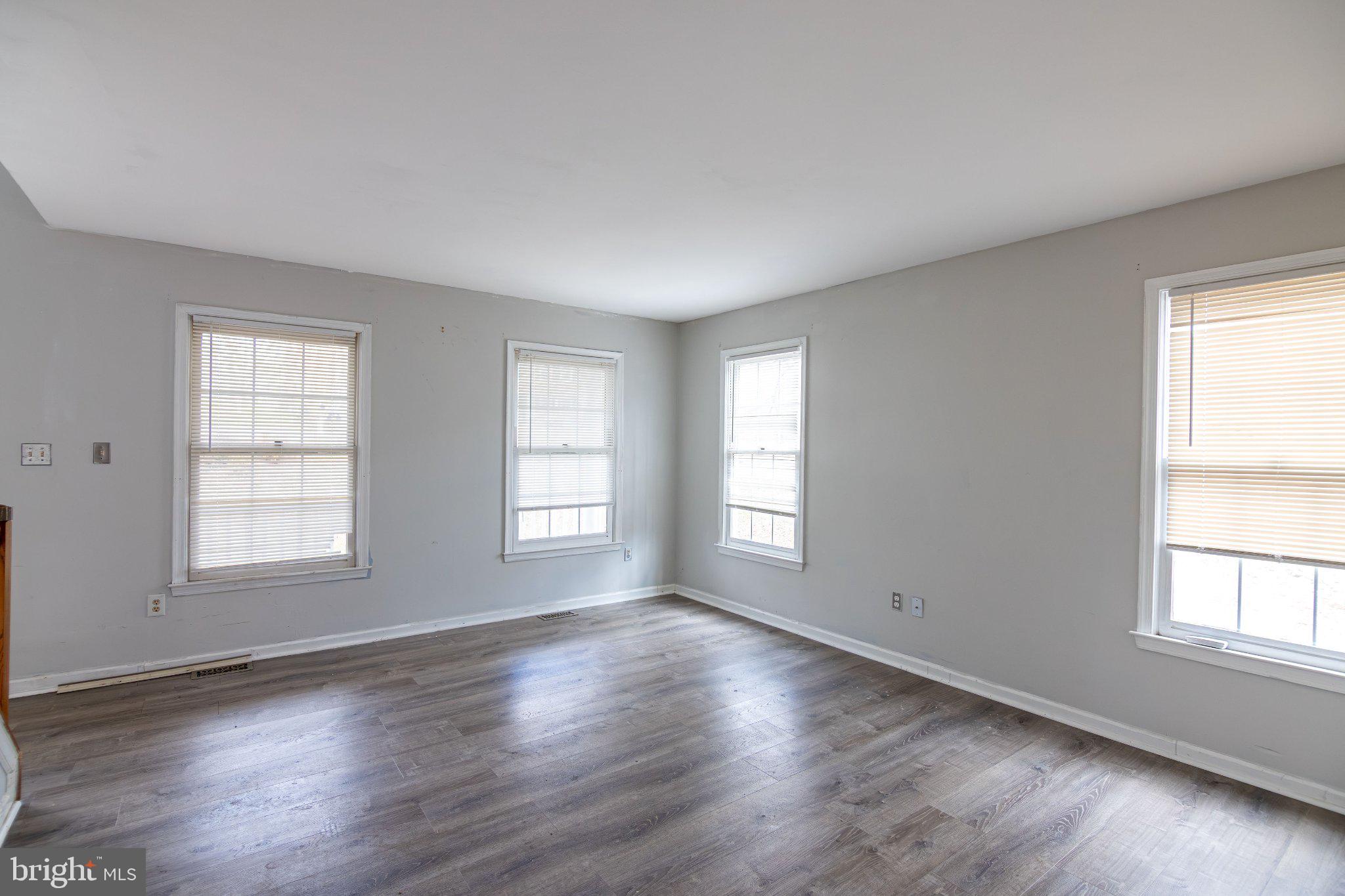 308 Raft Cove Stafford, VA 22554 - Photo 4 of 28 an empty room with wooden floor and windows