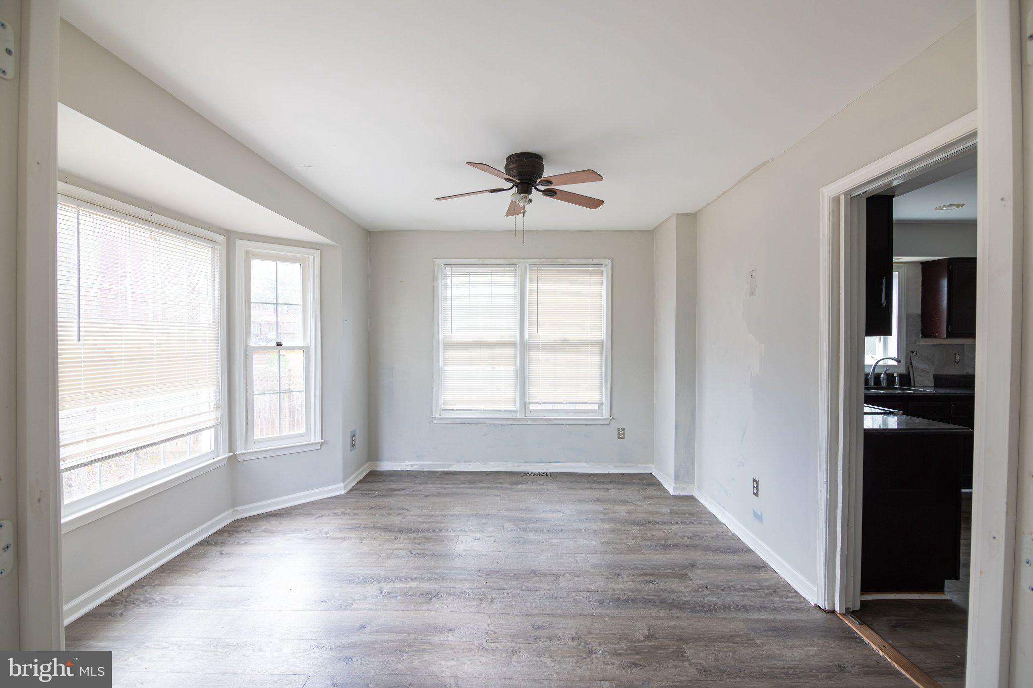 308 Raft Cove Stafford, VA 22554 - Photo 5 of 28 a view of empty room with wooden floor and fan