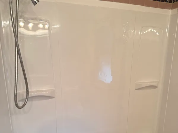 a bathroom with a granite countertop sink and a window