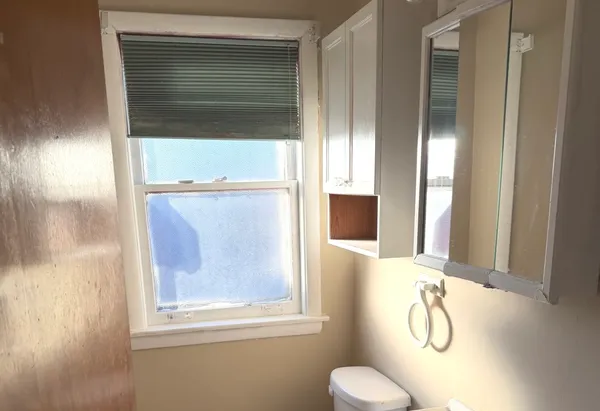 a bathroom with a shower and a sink