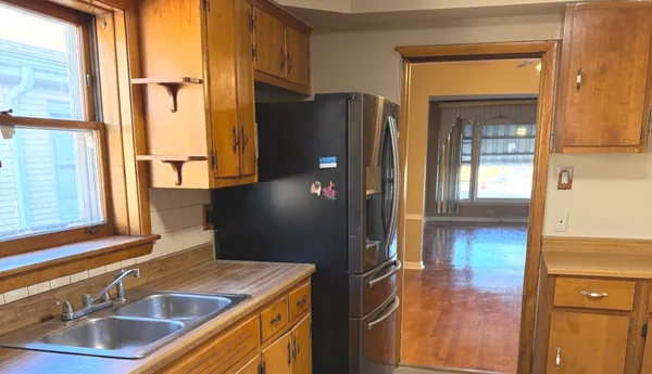 a stove top oven sitting inside of a kitchen
