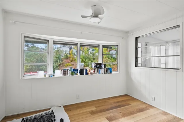 a view of room with window and ceiling fan