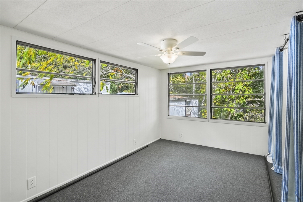 83 Clark Road, Unit 41 Shirley, MA 01464 - Photo 15 of 26 a view of room with window and ceiling fan