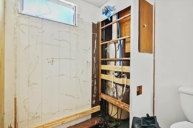 a view of a house with a balcony and door