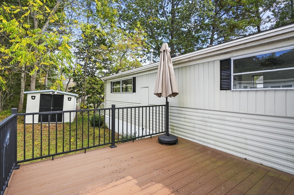 83 Clark Road, Unit 41 Shirley, MA 01464 - Photo 22 of 26 a view of a house with a wooden fence
