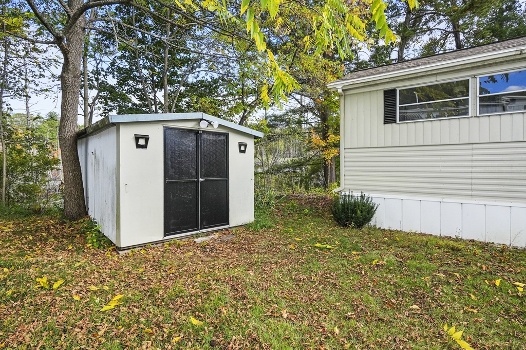 83 Clark Road, Unit 41 Shirley, MA 01464 - Photo 24 of 26 a front view of a house with garden