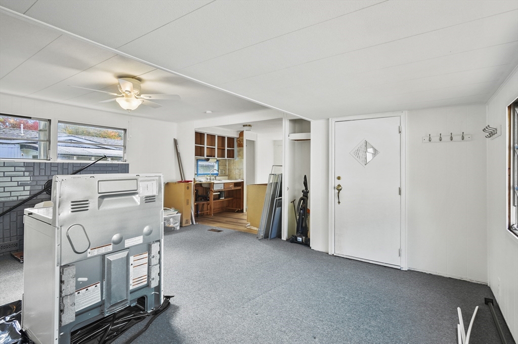 83 Clark Road, Unit 41 Shirley, MA 01464 - Photo 8 of 26 a view of kitchen with furniture and windows