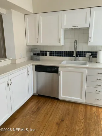 a kitchen with a sink and cabinets