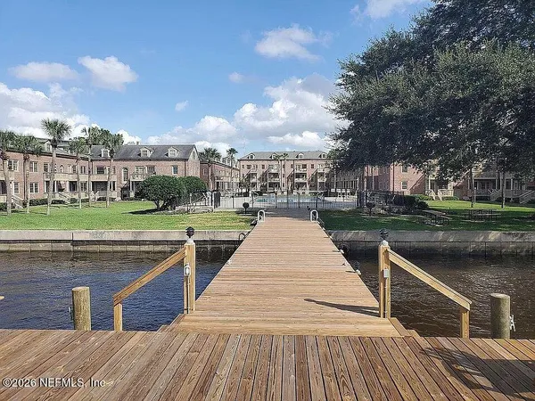 a park view with a barbeque oven and a yard