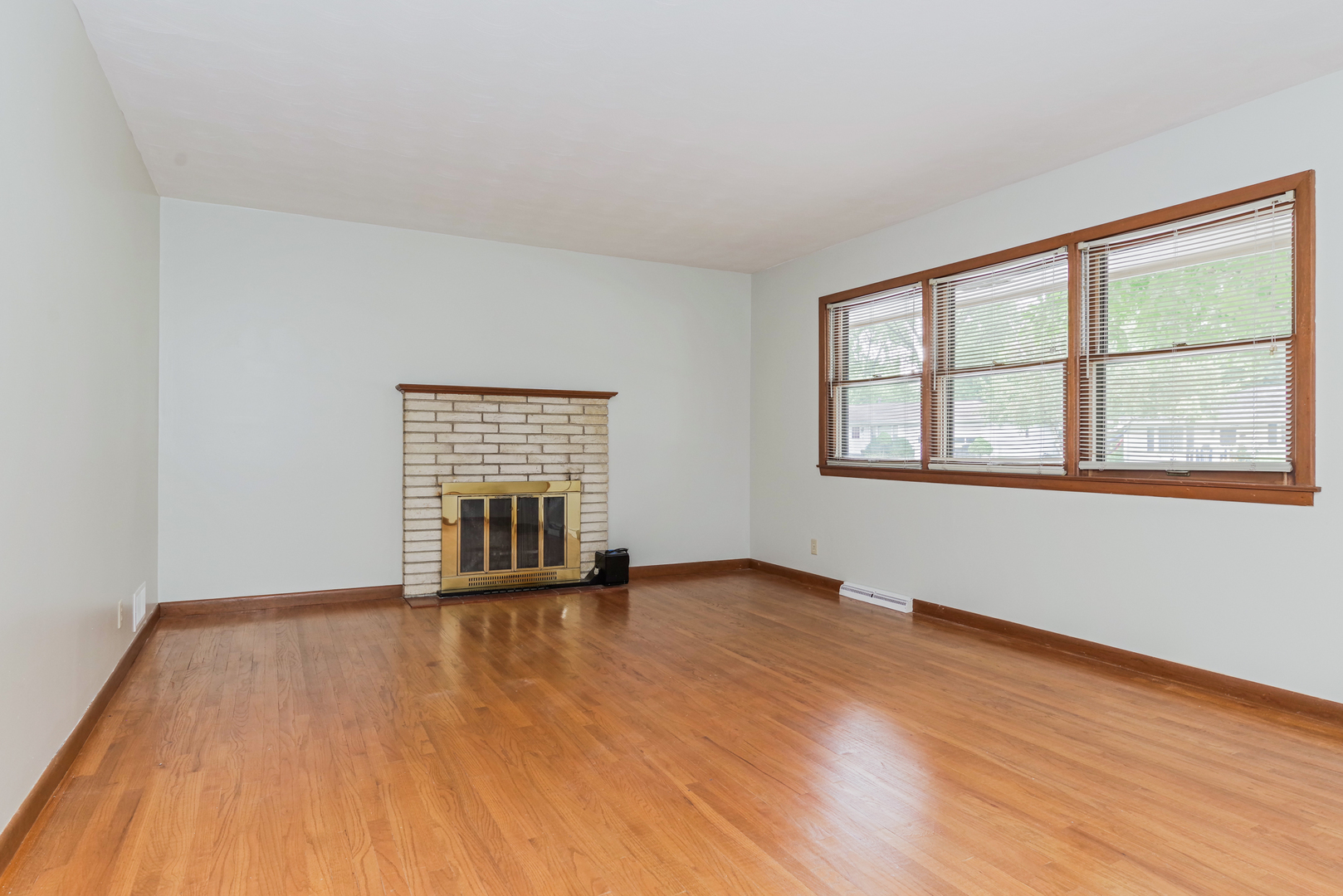 22 Ardith Drive Normal, IL 61761 - Photo 15 of 51 a view of an empty room with wooden floor and a window
