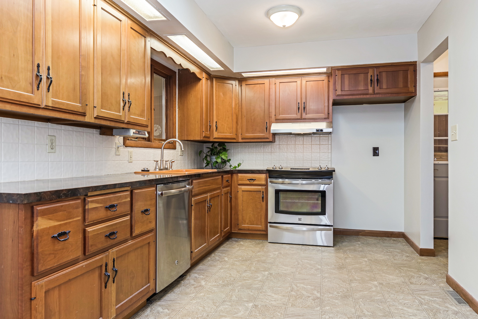 22 Ardith Drive Normal, IL 61761 - Photo 17 of 51 a kitchen with stainless steel appliances granite countertop a stove and cabinets