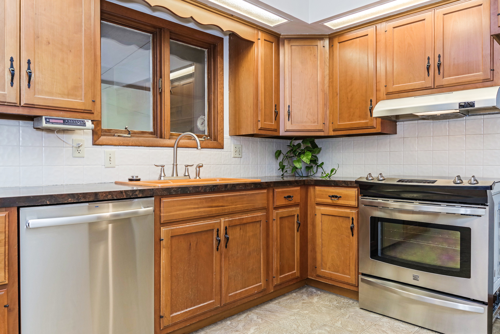 22 Ardith Drive Normal, IL 61761 - Photo 18 of 51 a kitchen with stainless steel appliances granite countertop white cabinets and a stove top oven with granite countertops