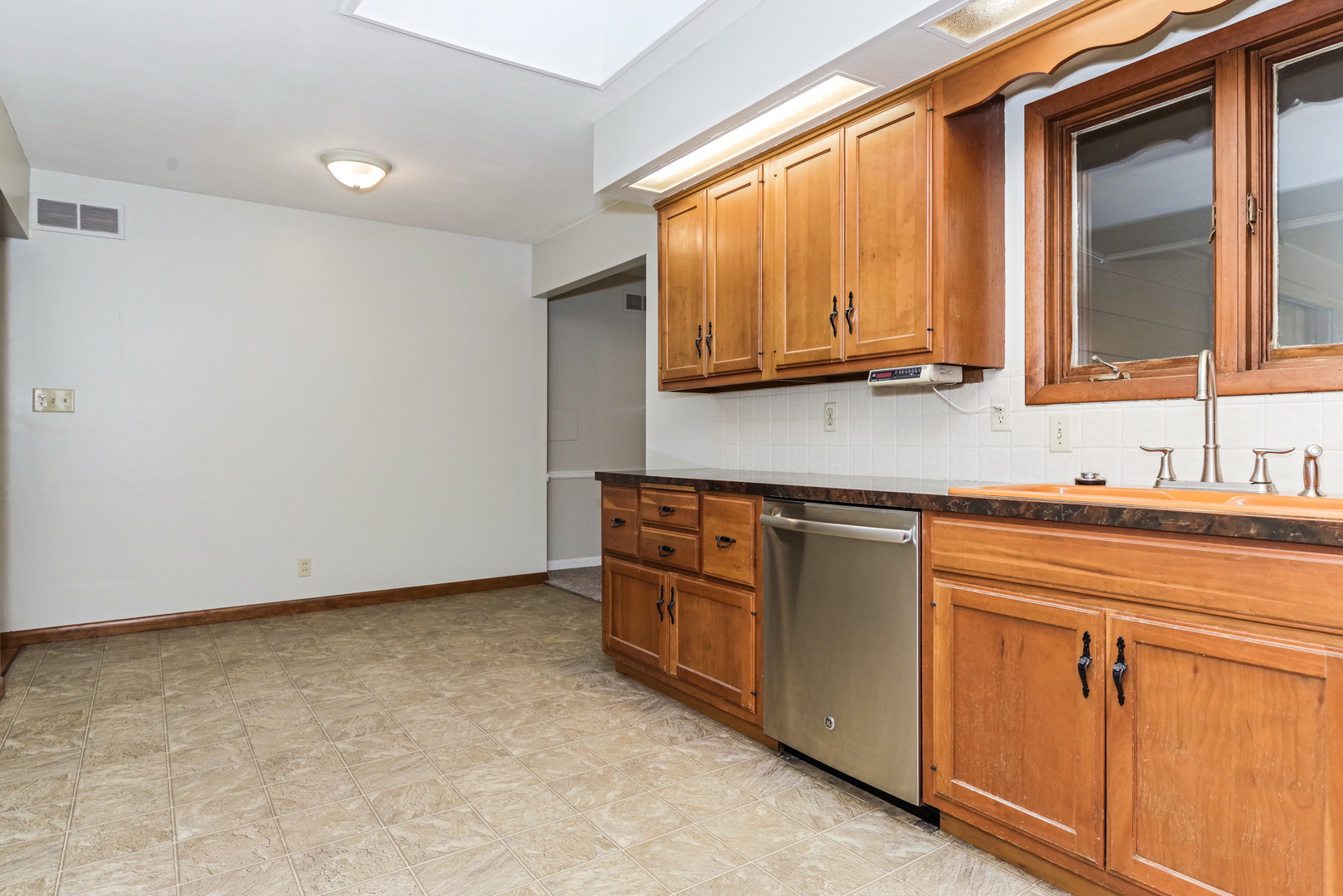 22 Ardith Drive Normal, IL 61761 - Photo 19 of 51 a kitchen with stainless steel appliances granite countertop a sink and a stove top oven