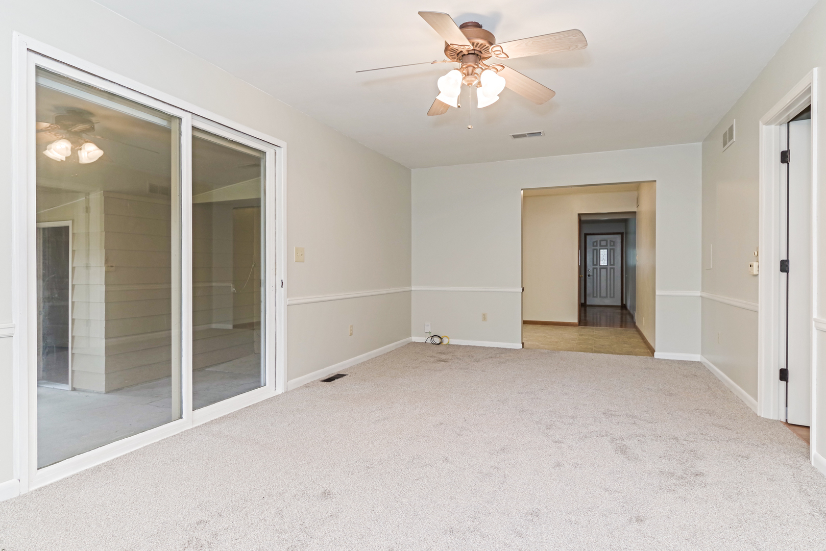 22 Ardith Drive Normal, IL 61761 - Photo 22 of 51 an empty room with chandelier fan and windows