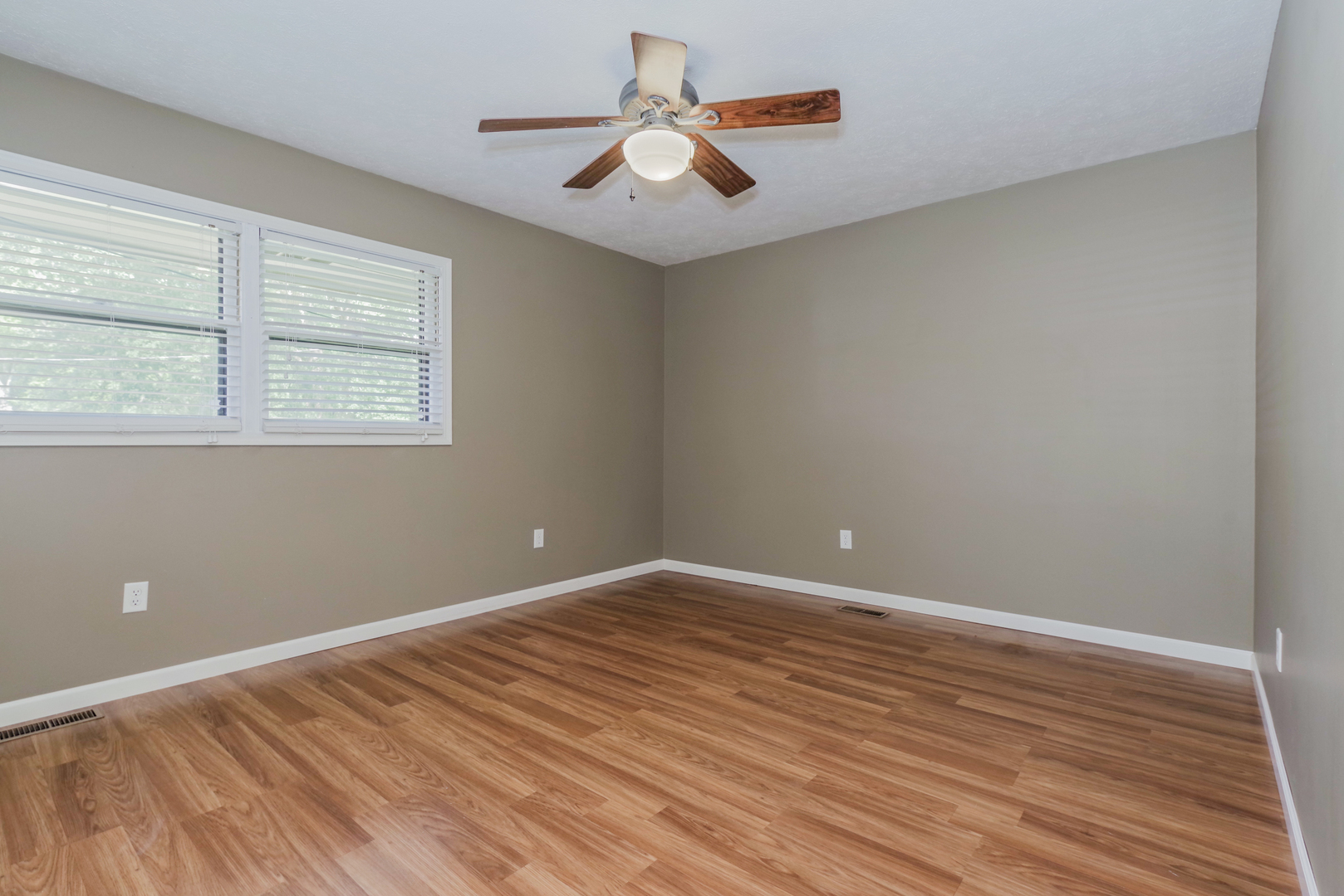 22 Ardith Drive Normal, IL 61761 - Photo 23 of 51 an empty room with wooden floor and windows