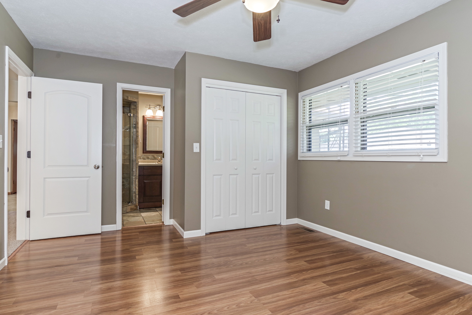 22 Ardith Drive Normal, IL 61761 - Photo 24 of 51 an empty room with wooden floor chandelier and windows