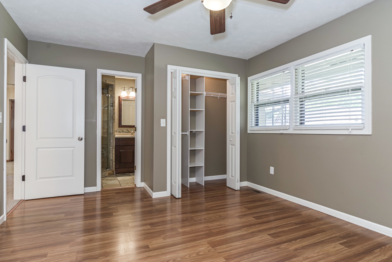 22 Ardith Drive Normal, IL 61761 - Photo 25 of 51 a view of an empty room with wooden floor and a window
