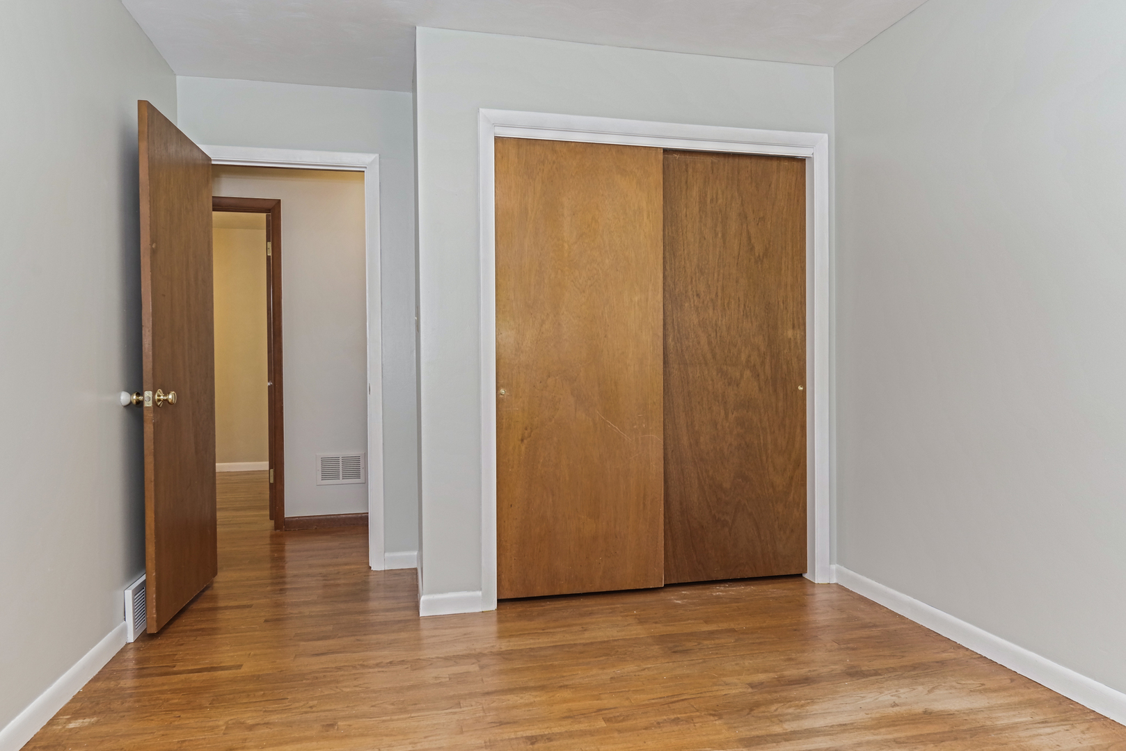 22 Ardith Drive Normal, IL 61761 - Photo 29 of 51 a view of an empty room with wooden floor and a bathroom