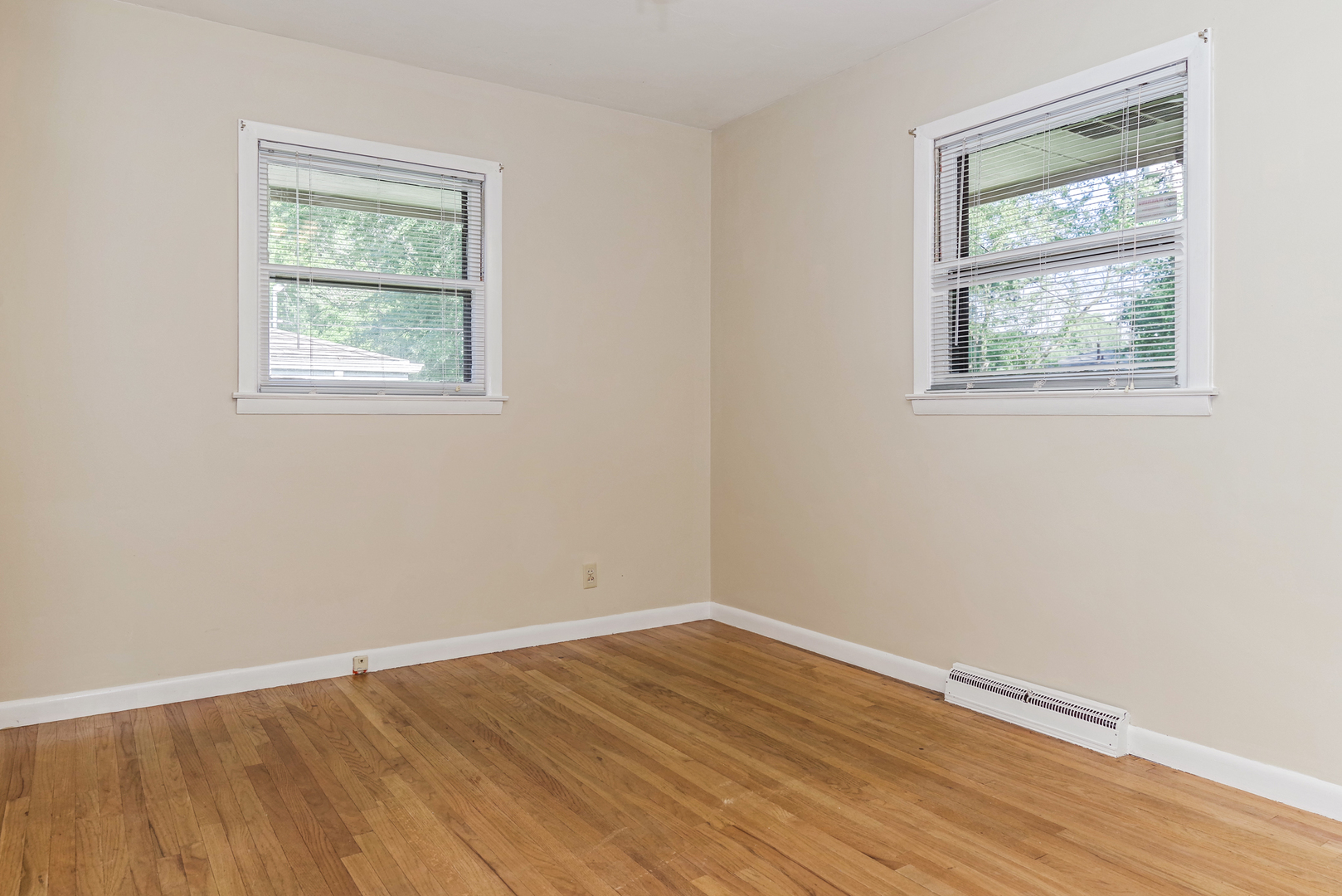 22 Ardith Drive Normal, IL 61761 - Photo 30 of 51 a view of an empty room with wooden floor and a window