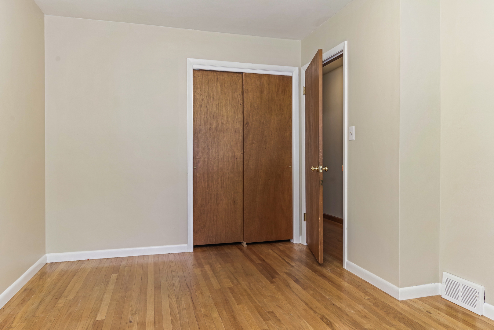 22 Ardith Drive Normal, IL 61761 - Photo 31 of 51 an empty room with wooden floor and closet