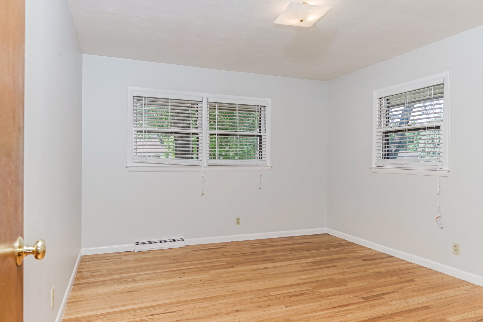 22 Ardith Drive Normal, IL 61761 - Photo 34 of 51 a view of an empty room with wooden floor and a window