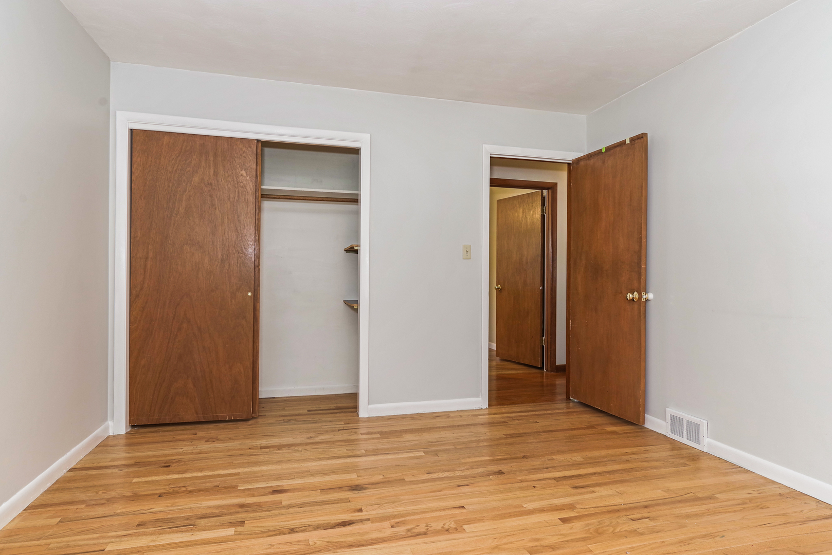 22 Ardith Drive Normal, IL 61761 - Photo 35 of 51 a view of an empty room with wooden floor and closet