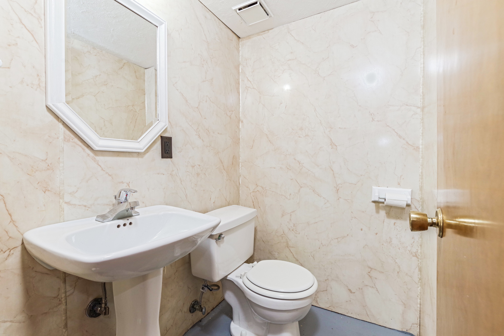 22 Ardith Drive Normal, IL 61761 - Photo 43 of 51 a bathroom with a sink a toilet and a mirror