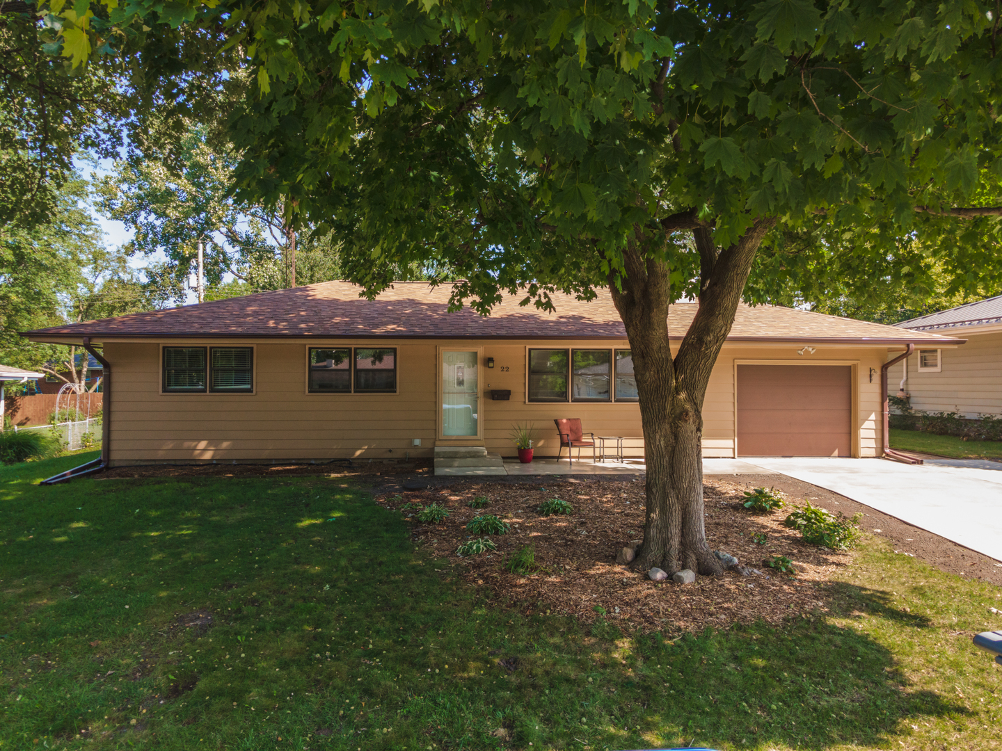 22 Ardith Drive Normal, IL 61761 - Photo 5 of 51 a front view of a house with a garden