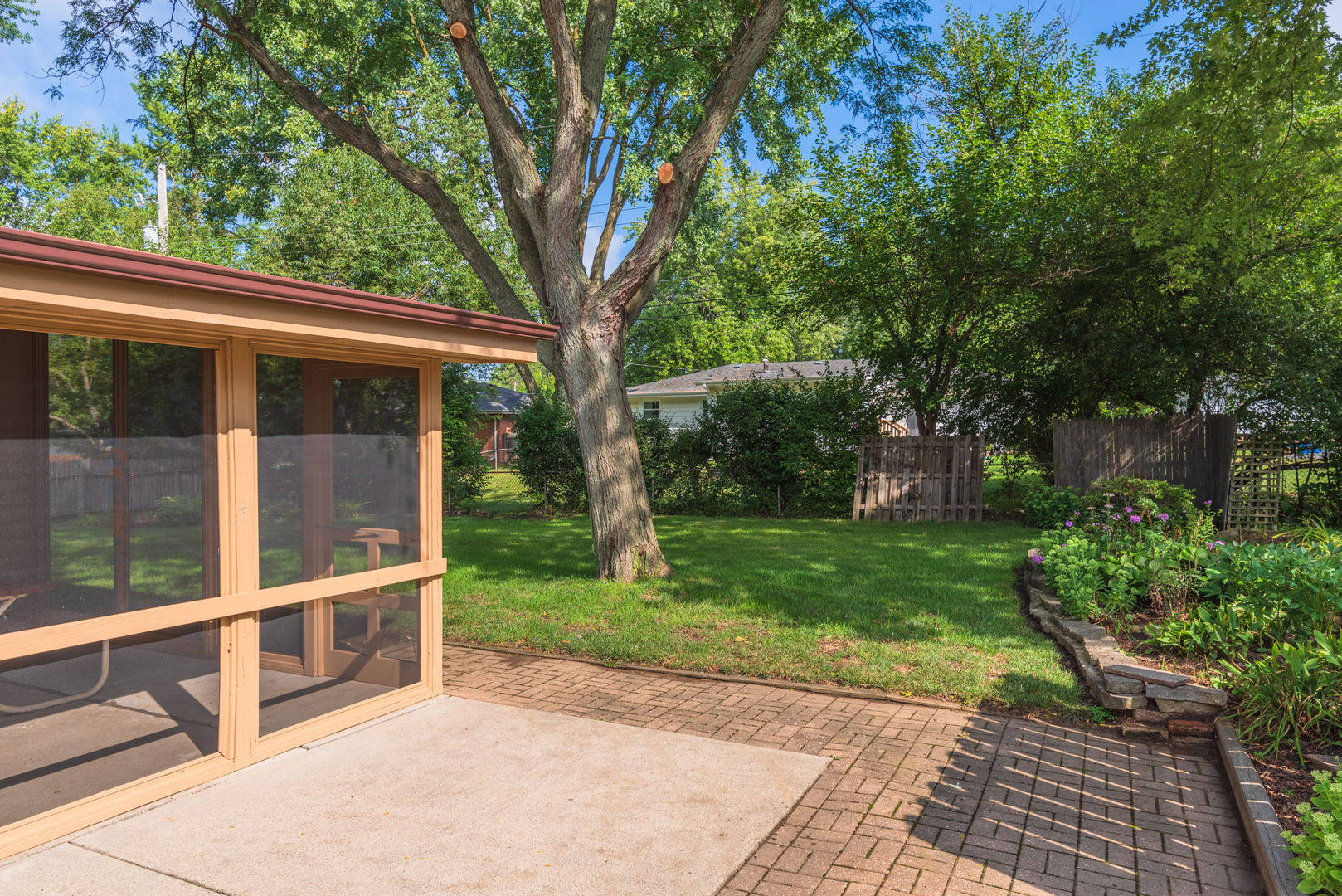 22 Ardith Drive Normal, IL 61761 - Photo 7 of 51 a view of a backyard with large trees and plants