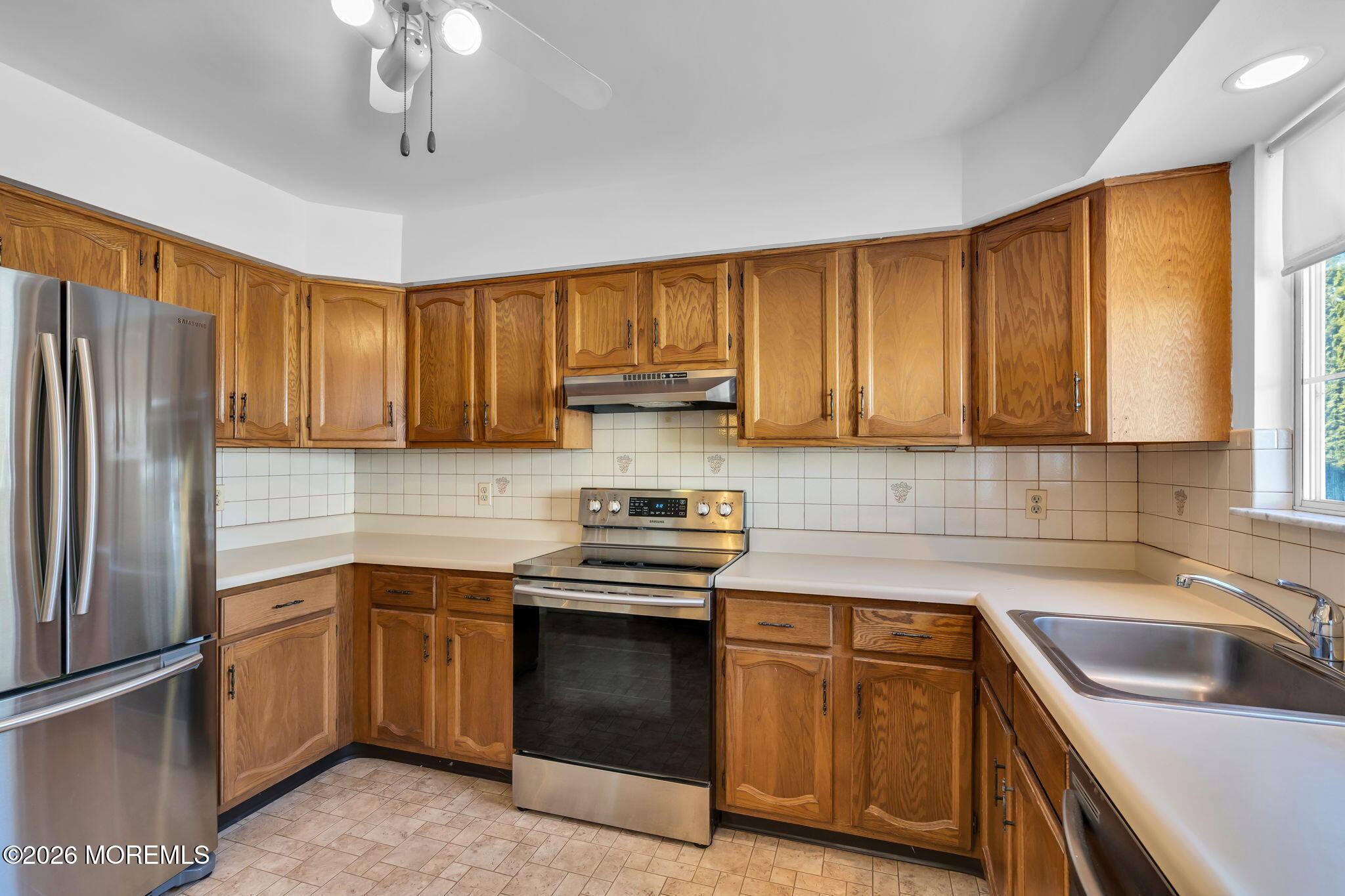 4 Andover Court, Unit 64 Whiting, NJ 08759 - Photo 14 of 23 a kitchen with a sink stove and refrigerator