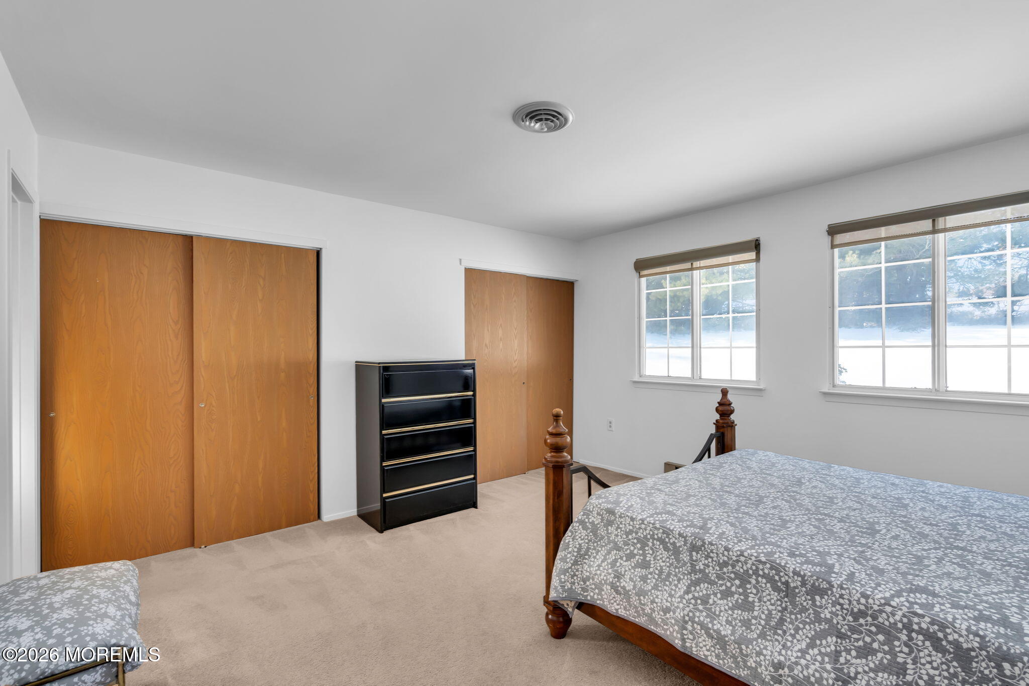 4 Andover Court, Unit 64 Whiting, NJ 08759 - Photo 17 of 23 a bedroom with a bed and a window