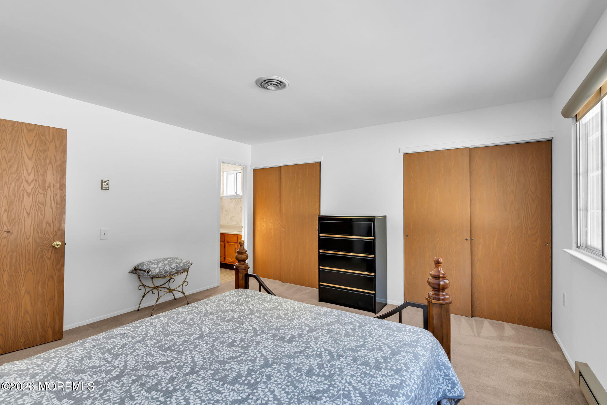 4 Andover Court, Unit 64 Whiting, NJ 08759 - Photo 18 of 23 a bedroom with a bed and a dresser