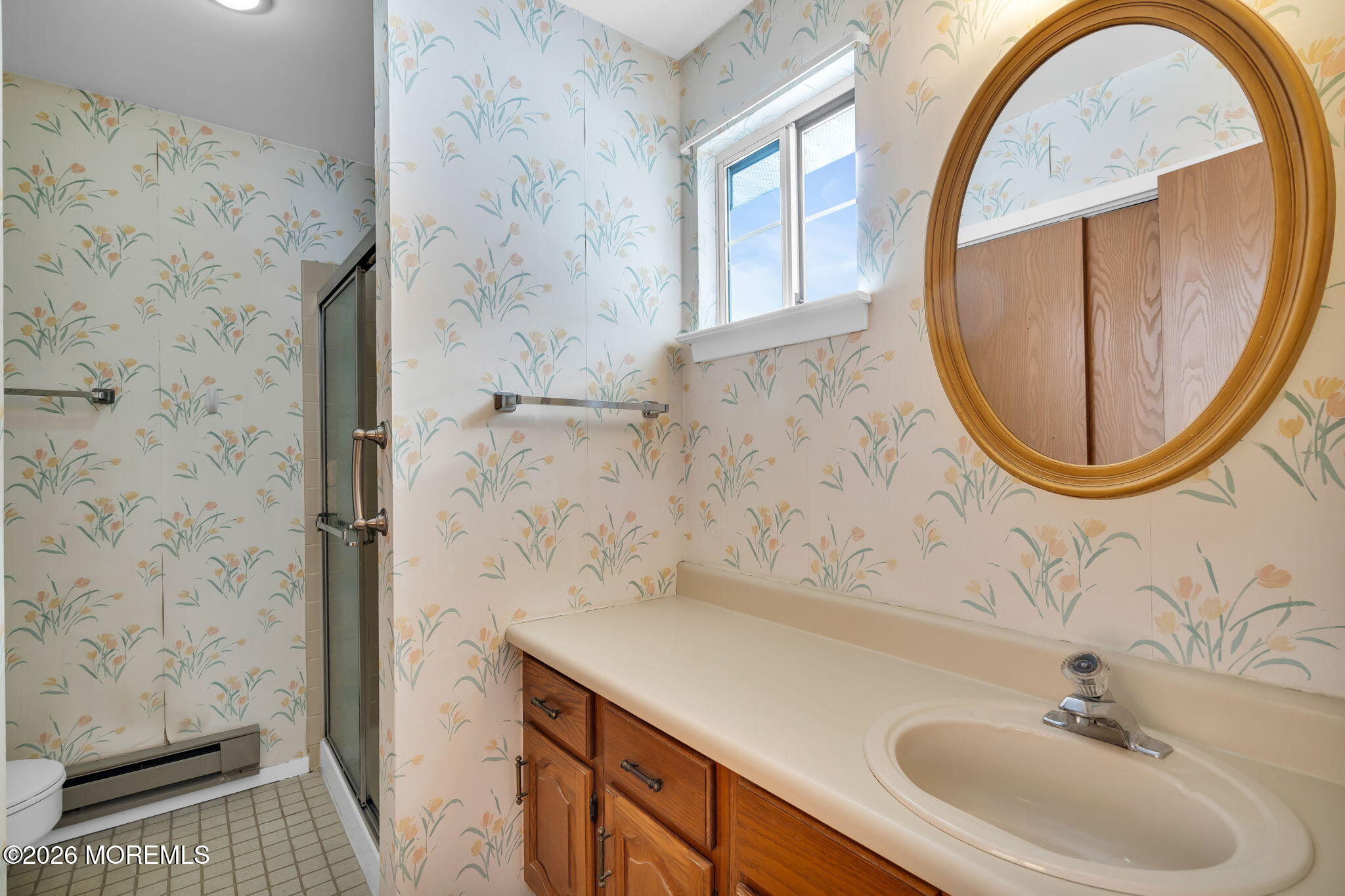 4 Andover Court, Unit 64 Whiting, NJ 08759 - Photo 19 of 23 a bathroom with a sink a vanity and a mirror