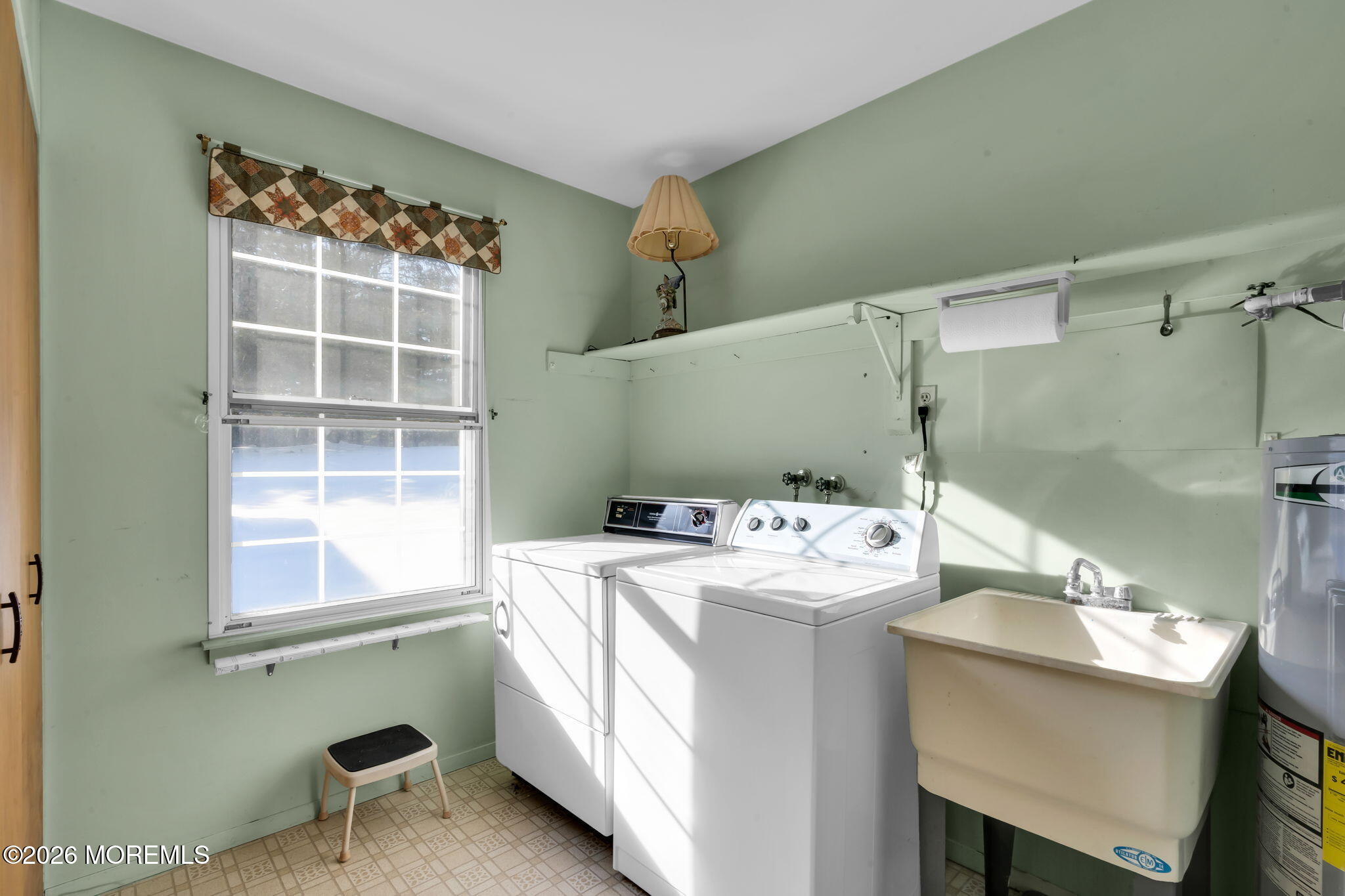 4 Andover Court, Unit 64 Whiting, NJ 08759 - Photo 20 of 23 a utility room with a window dryer and washer