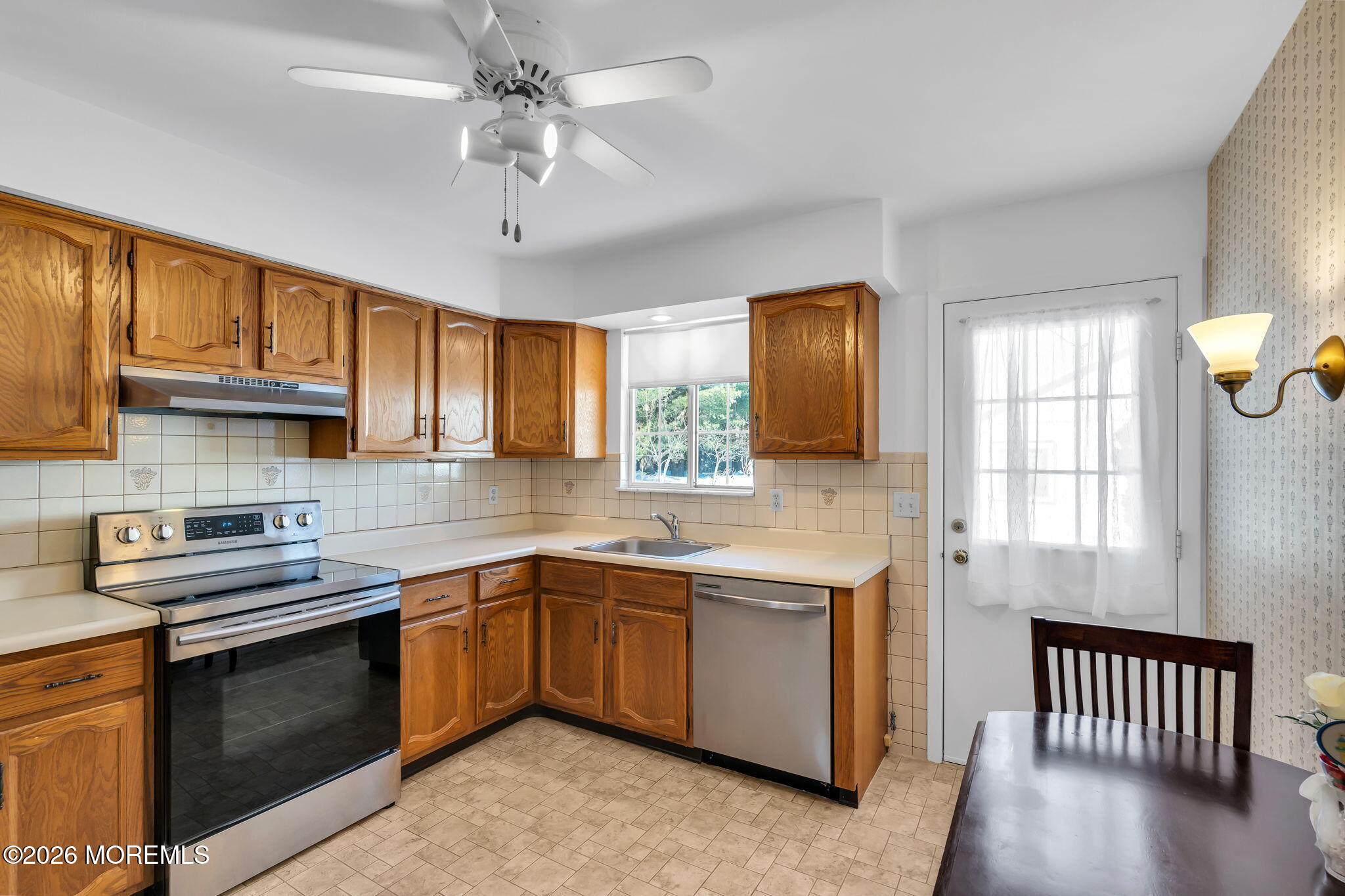 4 Andover Court, Unit 64 Whiting, NJ 08759 - Photo 21 of 23 a kitchen with stainless steel appliances granite countertop a sink stove and cabinets