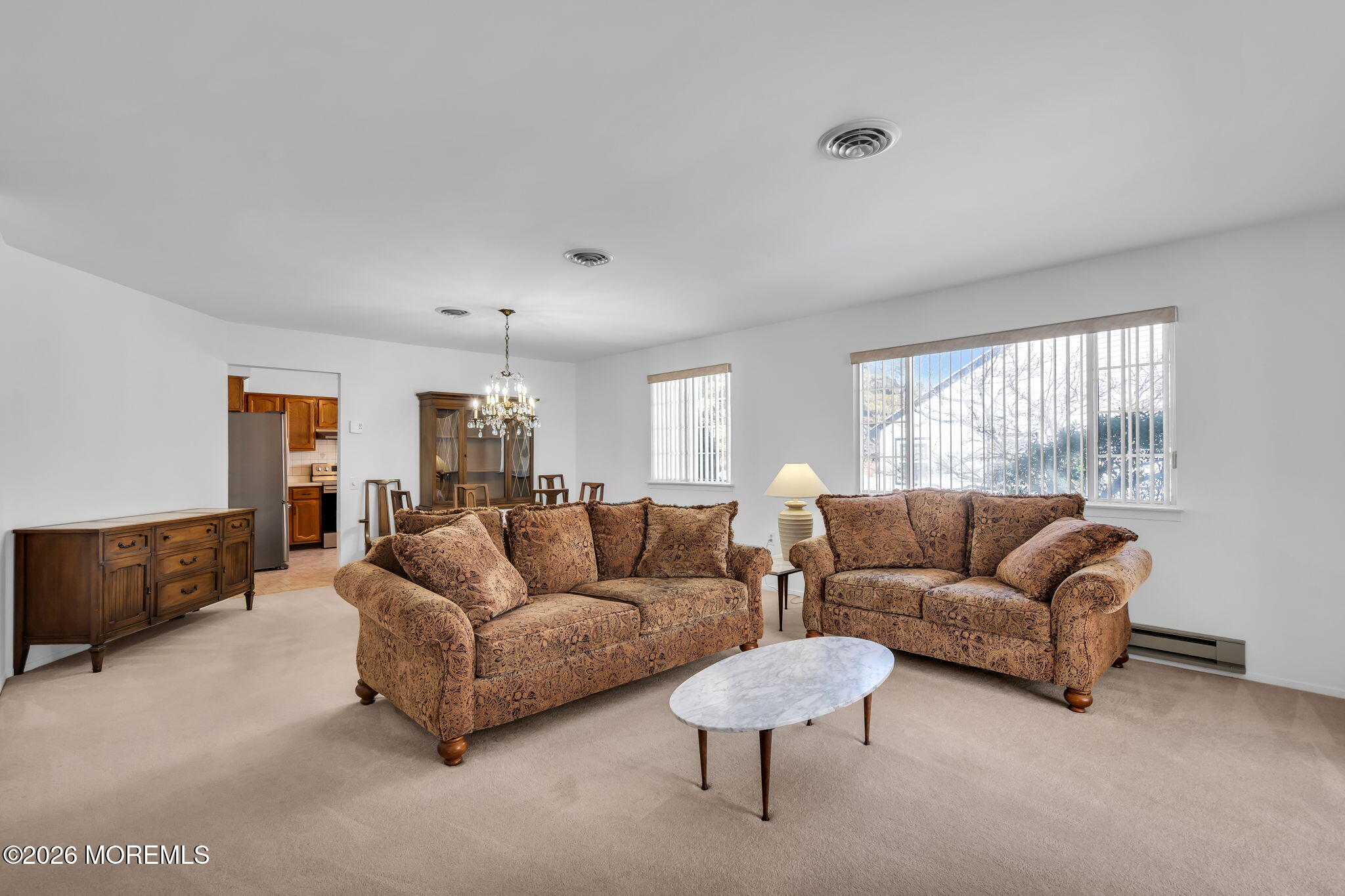 4 Andover Court, Unit 64 Whiting, NJ 08759 - Photo 7 of 23 a living room with furniture and a large window
