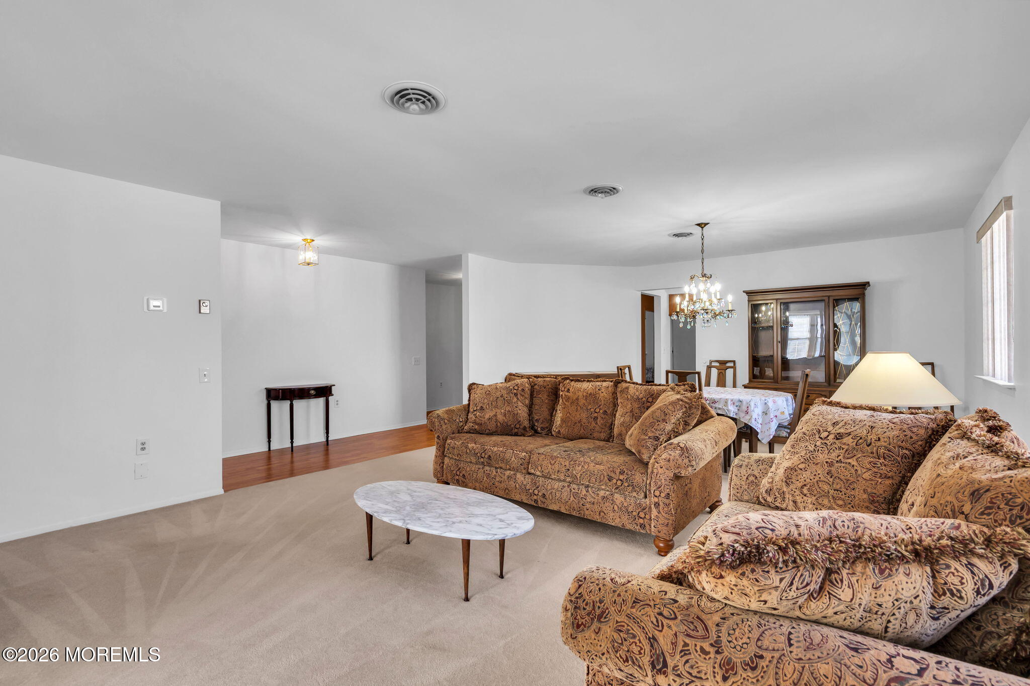 4 Andover Court, Unit 64 Whiting, NJ 08759 - Photo 8 of 23 a living room with furniture and a lamp