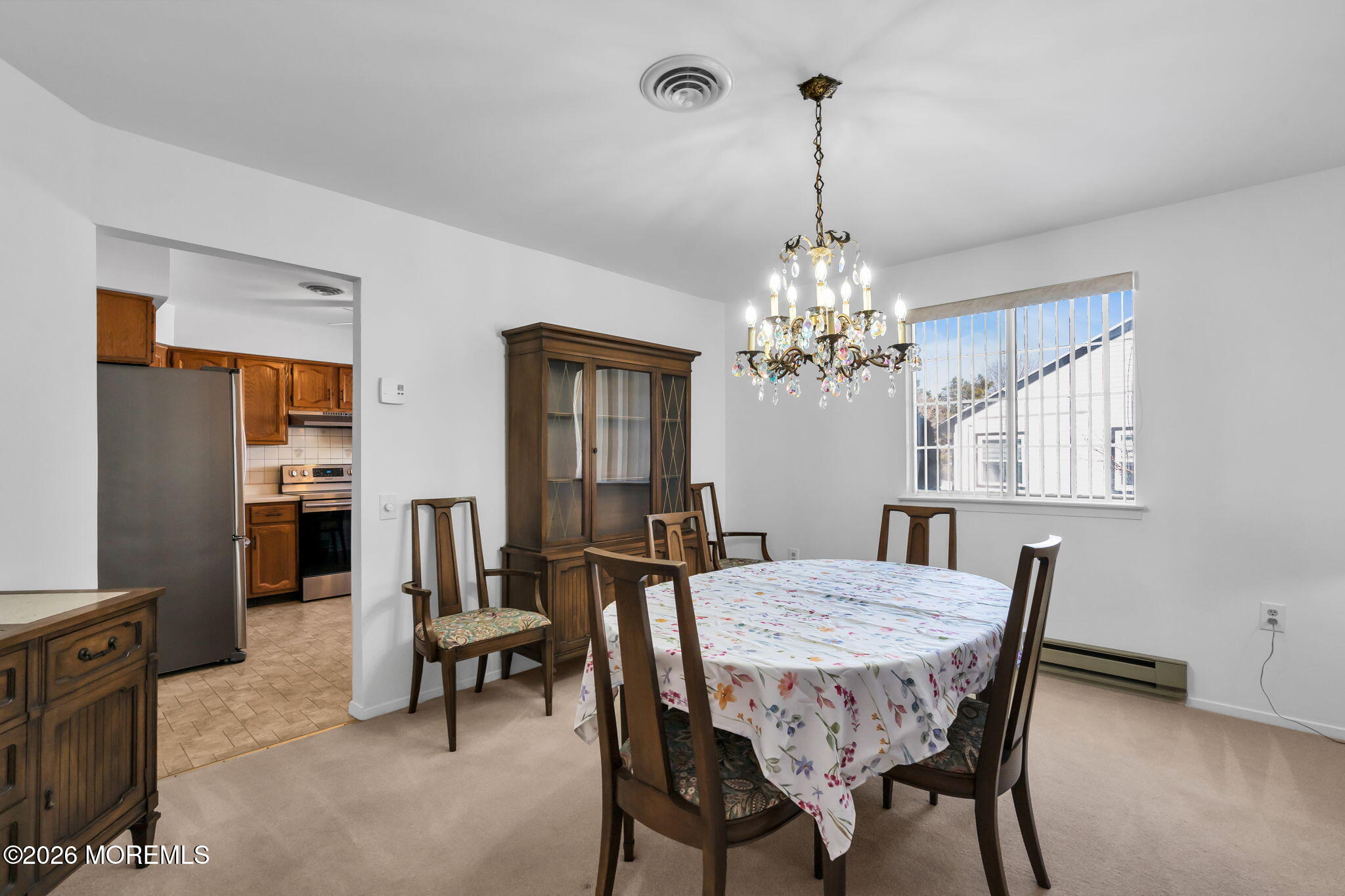 4 Andover Court, Unit 64 Whiting, NJ 08759 - Photo 10 of 23 a view of a dining room with furniture and chandelier