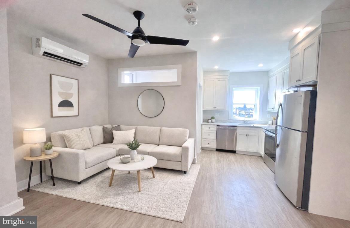 a living room with a couch and a refrigerator