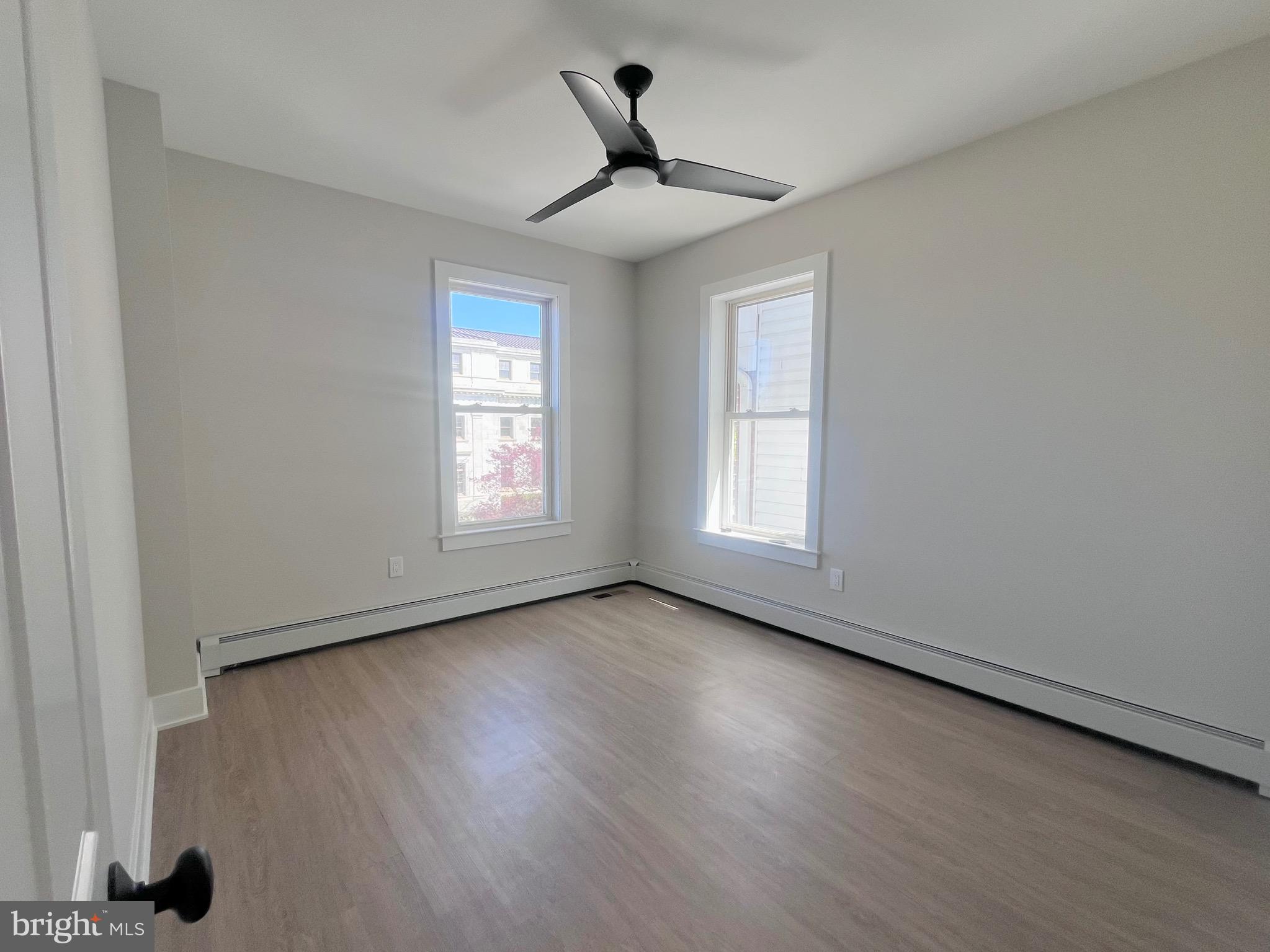 216 West Front Street, Unit 3 Media, PA 19063 - Photo 15 of 17 a view of an empty room with wooden floor and a window