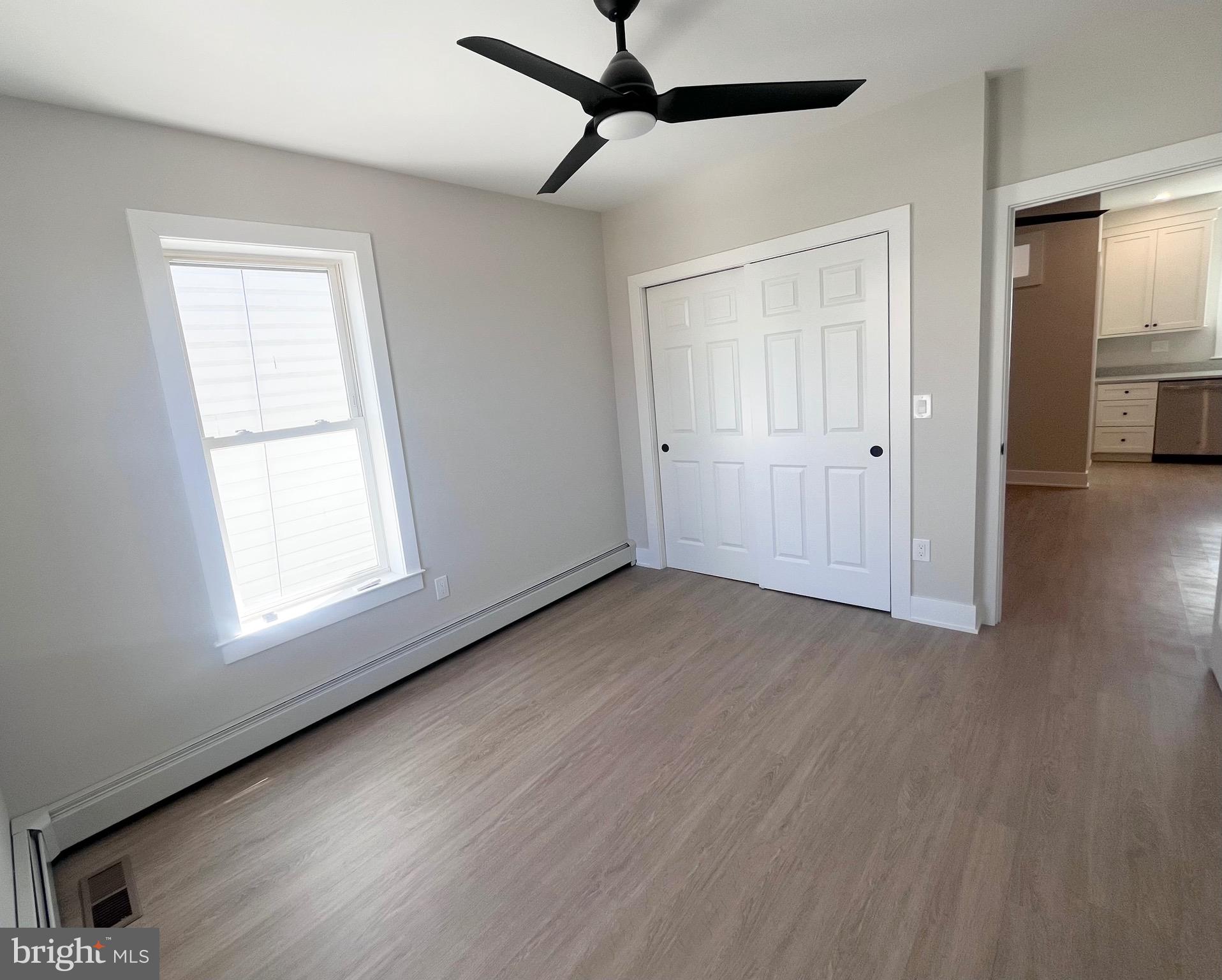 216 West Front Street, Unit 3 Media, PA 19063 - Photo 16 of 17 a view of an empty room with wooden floor and a window
