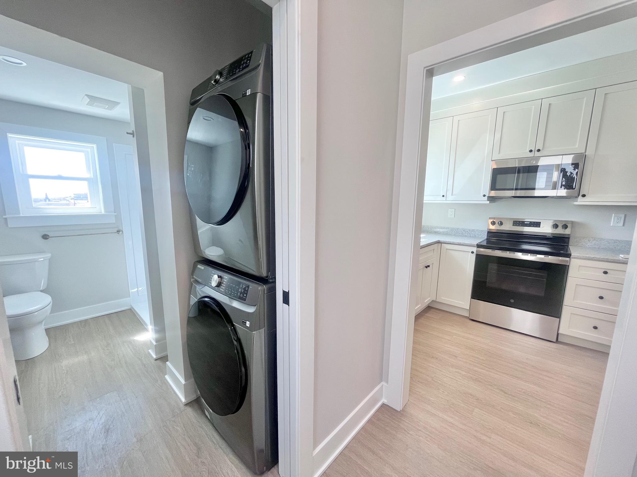 216 West Front Street, Unit 3 Media, PA 19063 - Photo 9 of 17 a kitchen with stainless steel appliances granite countertop a sink and a stove top oven