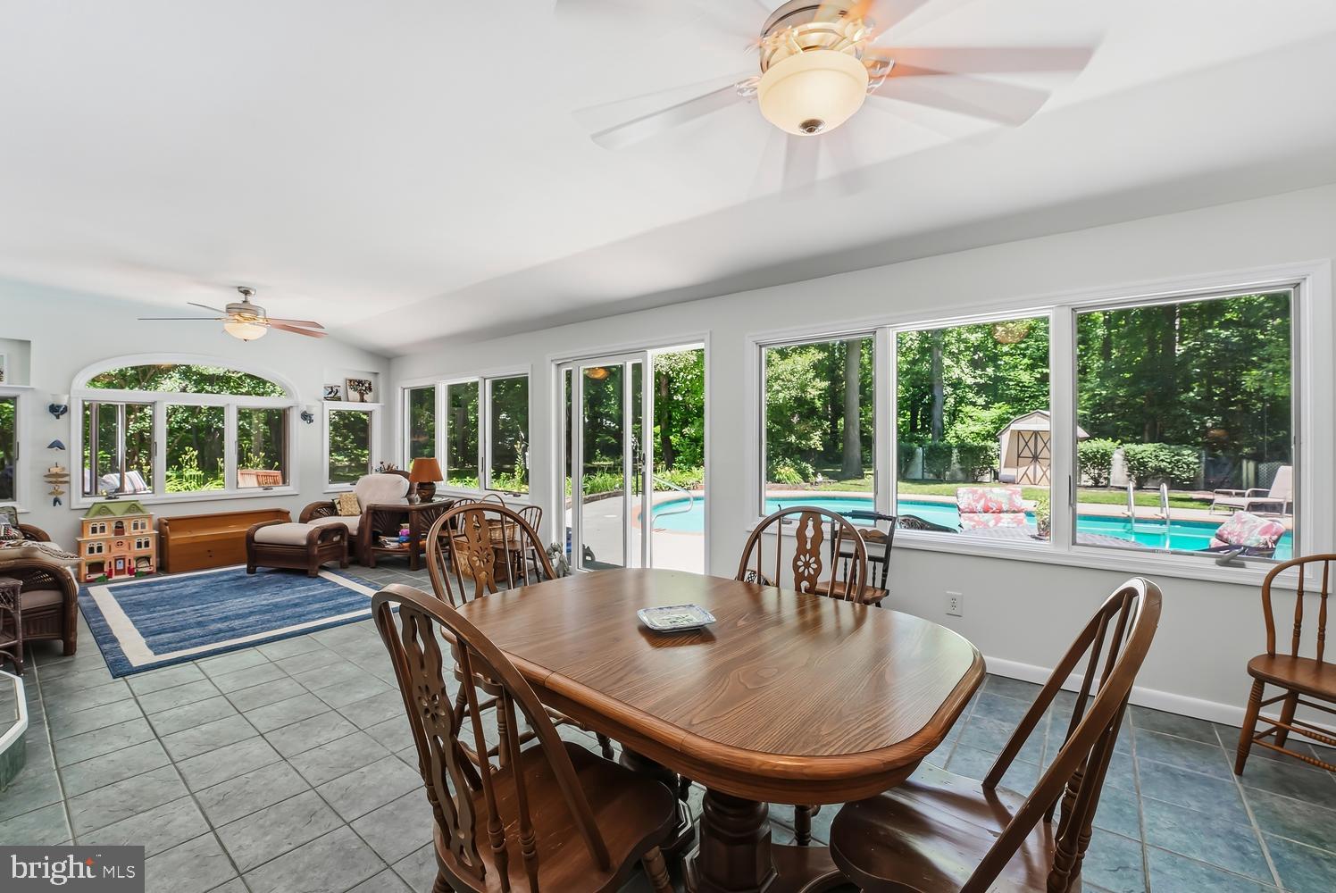 814 Wrights Neck Road Centreville, MD 21617 - Photo 37 of 53 a view of a dining room with furniture large windows and outside view