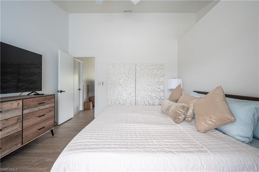 507 14th Street North Naples, FL 34102 - Photo 13 of 33 Bedroom with ceiling fan and hardwood / wood-style flooring