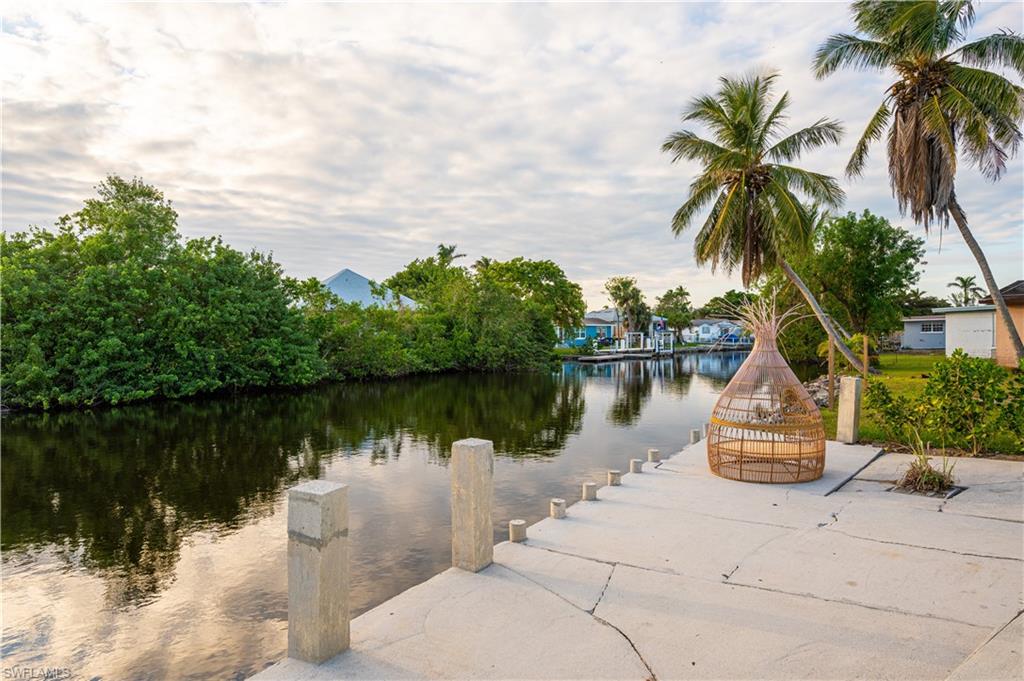 507 14th Street North Naples, FL 34102 - Photo 30 of 33 Property view of water with a boat dock