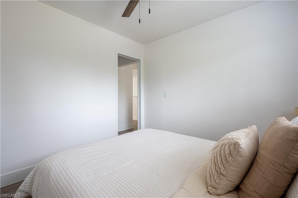 507 14th Street North Naples, FL 34102 - Photo 7 of 33 Bedroom with wood-type flooring and ceiling fan